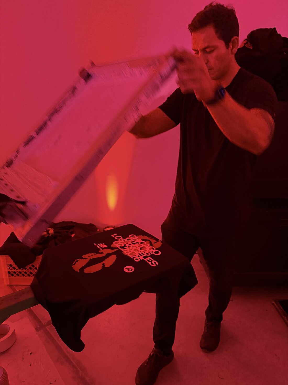 Merch Troop live printing — fresh prints off the platen